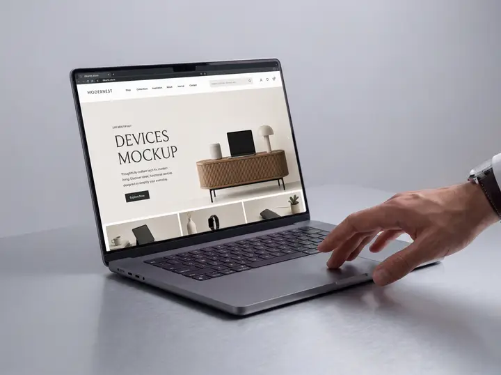 MacBook Mockup with Hand and Aluminum Table