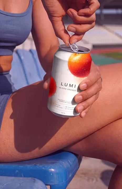 Soda Can Mockup Opening by a Sporty Woman